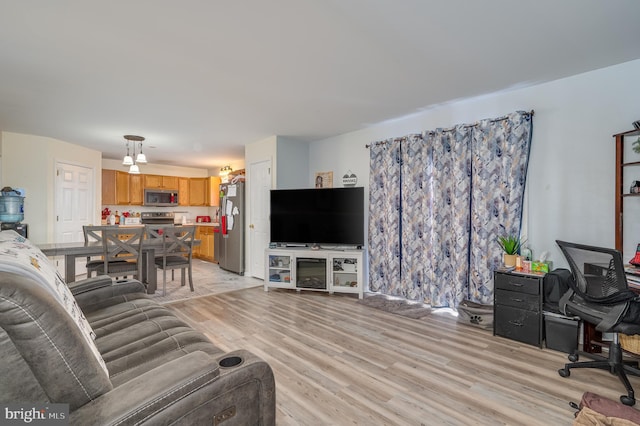 living room with light hardwood / wood-style floors