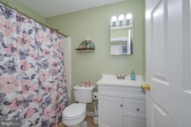 bathroom featuring vanity, toilet, and a shower with shower curtain