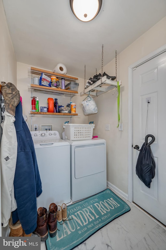 laundry area with washing machine and dryer