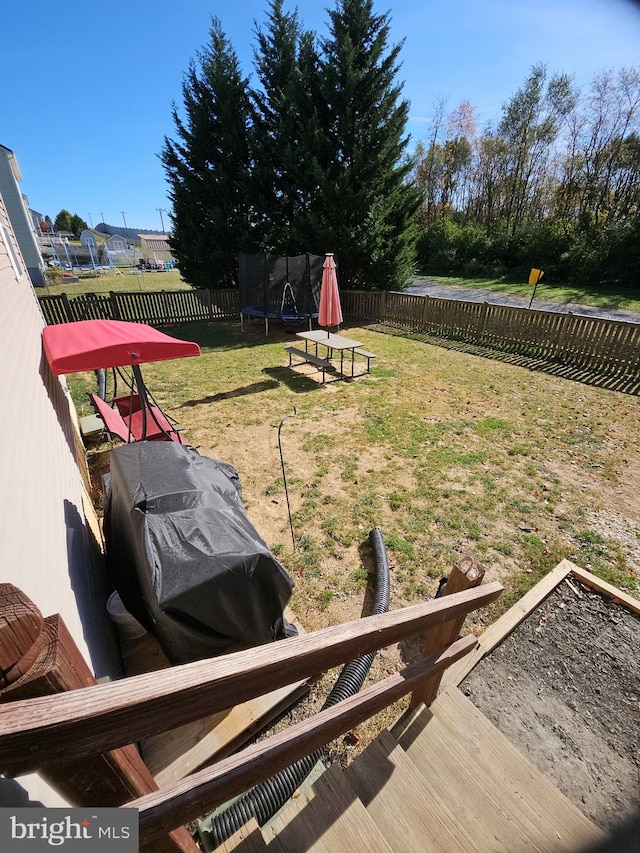 view of yard featuring a trampoline