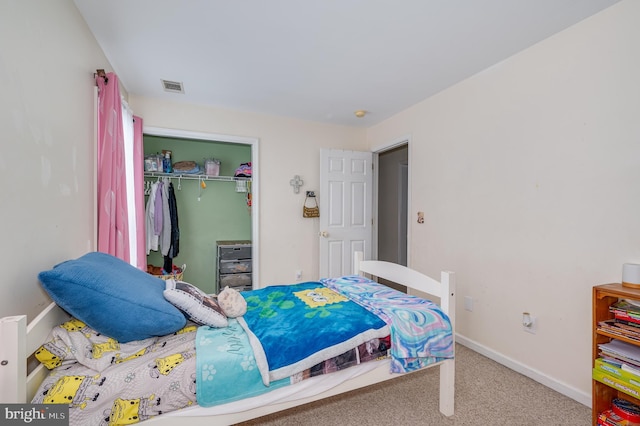 carpeted bedroom with a closet