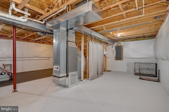 basement featuring water heater, heating unit, and electric panel