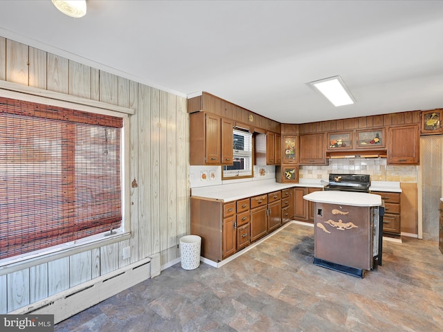 kitchen with black range oven, a kitchen island, and baseboard heating