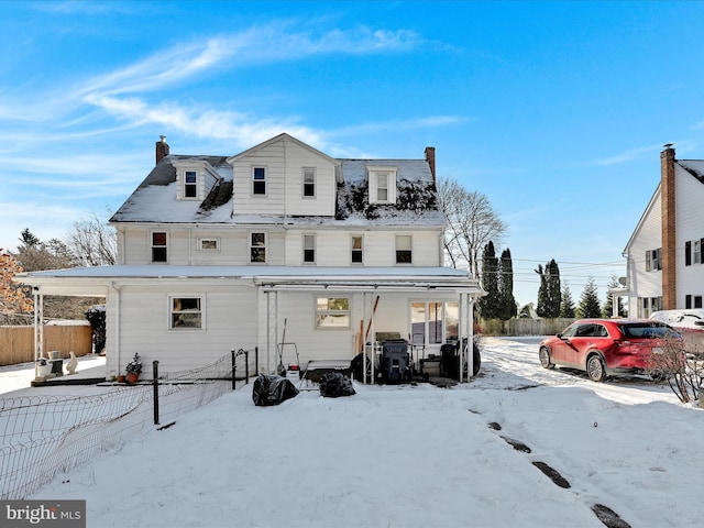 view of snow covered house