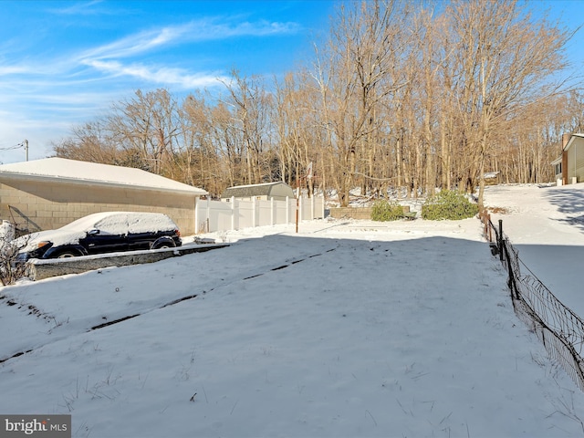 view of yard layered in snow