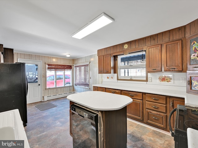 kitchen featuring black appliances, a center island, a wealth of natural light, and a baseboard heating unit