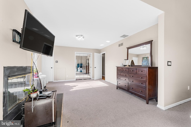 living area with light colored carpet