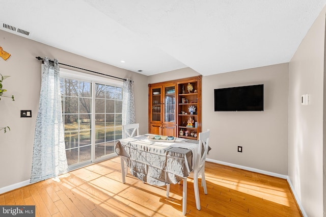 dining space featuring hardwood / wood-style flooring