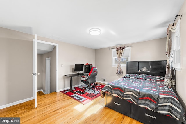 bedroom with wood-type flooring