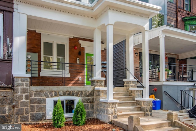 property entrance with covered porch