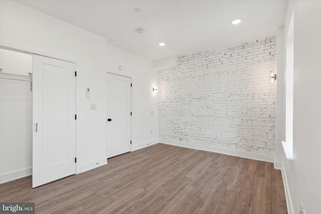 unfurnished bedroom with light hardwood / wood-style floors