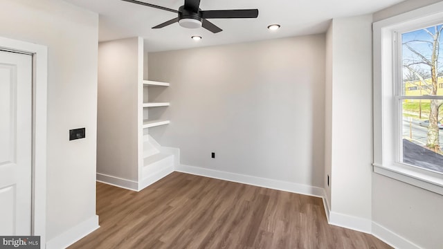 unfurnished room featuring ceiling fan and wood-type flooring