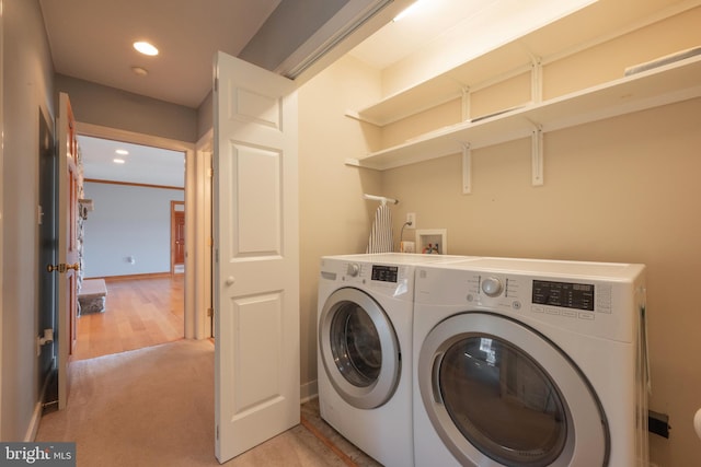 washroom with light carpet and washer and clothes dryer