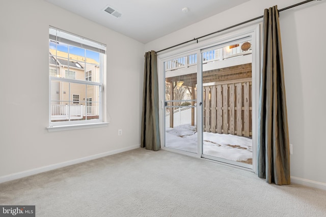 empty room featuring light colored carpet