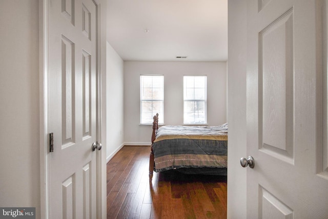 bedroom with wood-type flooring