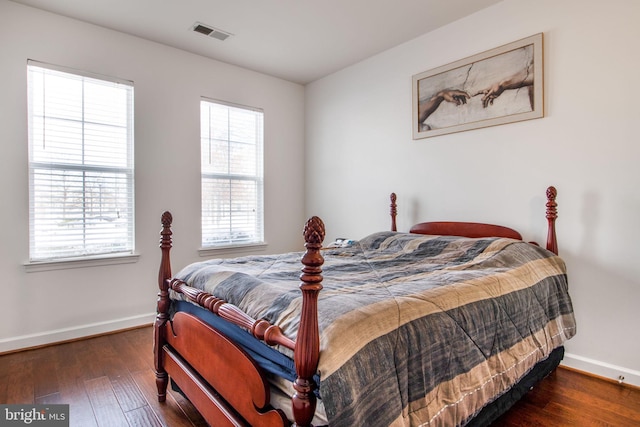 bedroom featuring dark wood-type flooring