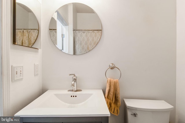 bathroom with toilet and sink