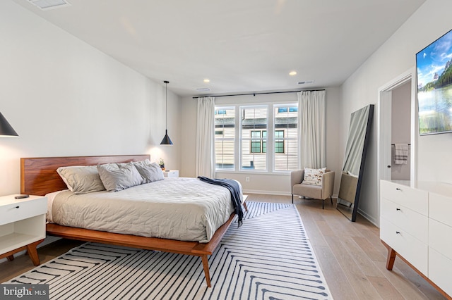 bedroom with light wood-type flooring