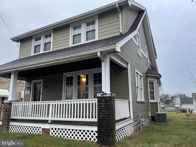 view of front of property featuring a porch and central AC