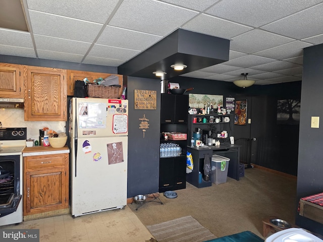 kitchen with a drop ceiling and white appliances