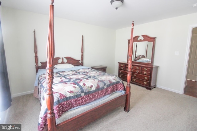 bedroom with light colored carpet