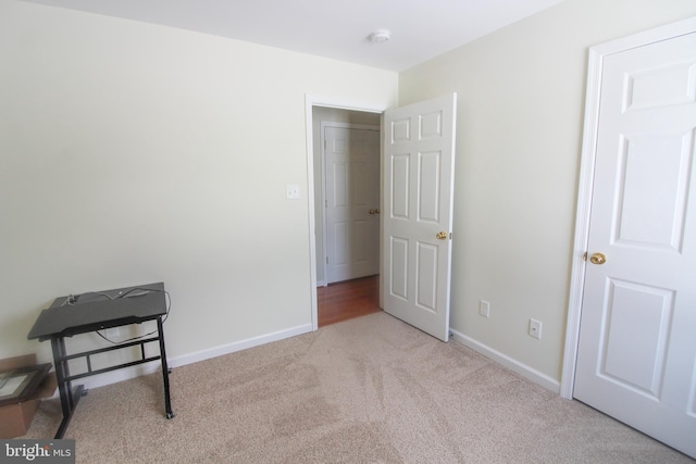 bedroom with light colored carpet