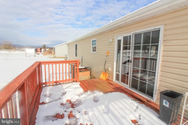 view of snow covered deck