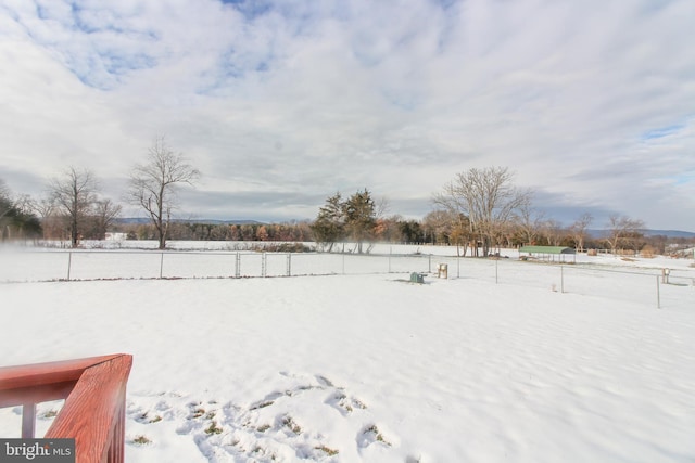 view of yard layered in snow