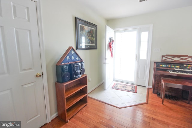 foyer entrance with light hardwood / wood-style floors