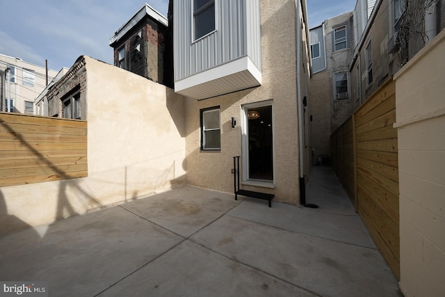 property entrance featuring a patio