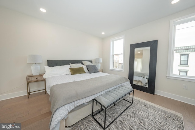 bedroom with hardwood / wood-style flooring