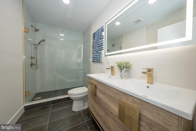 bathroom featuring vanity, toilet, and walk in shower