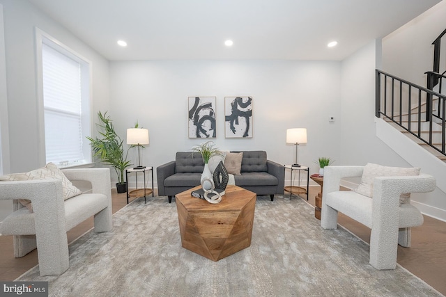 living room with light wood-type flooring and a wealth of natural light