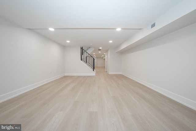 basement featuring light hardwood / wood-style floors