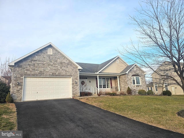 view of front facade featuring a front lawn and a garage