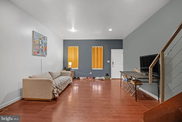 living area with hardwood / wood-style flooring