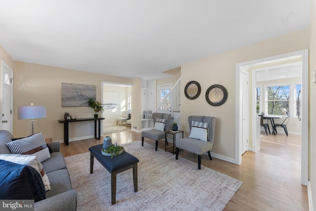 living room with light hardwood / wood-style flooring