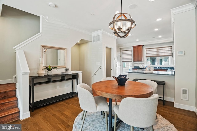 dining space with a chandelier, dark hardwood / wood-style flooring, and ornamental molding