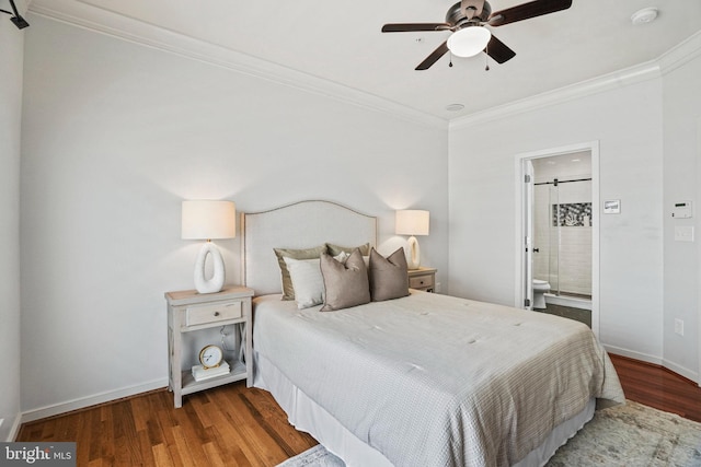 bedroom with hardwood / wood-style flooring, ensuite bath, ceiling fan, and crown molding