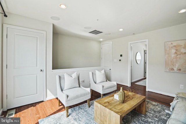 living room with dark hardwood / wood-style floors