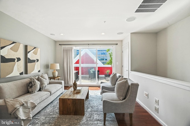 living room featuring dark wood-type flooring