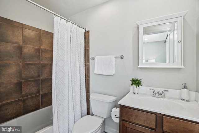 full bathroom featuring vanity, shower / bath combination with curtain, and toilet