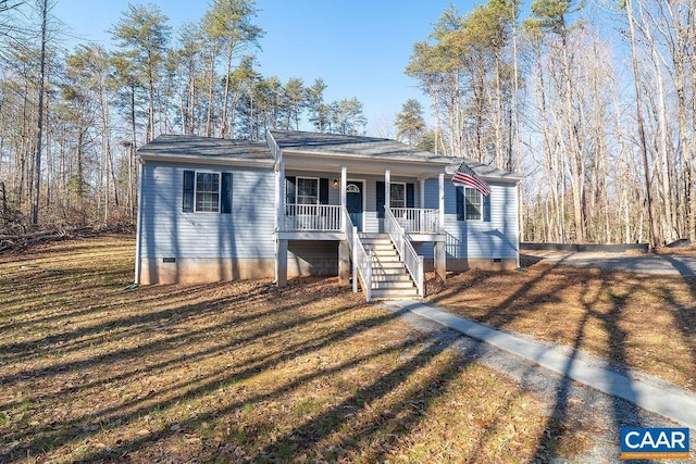 view of front facade with a porch and a front lawn