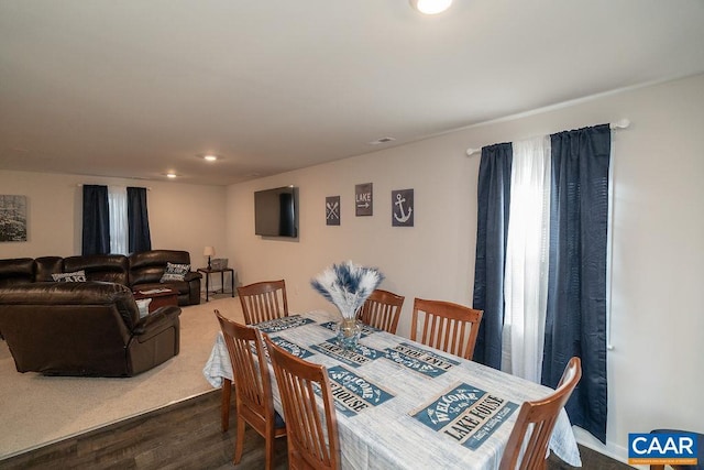 dining space featuring dark wood-type flooring