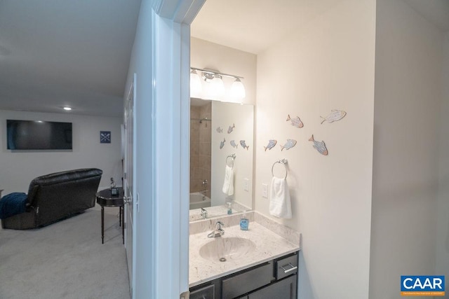 bathroom featuring bathing tub / shower combination and vanity