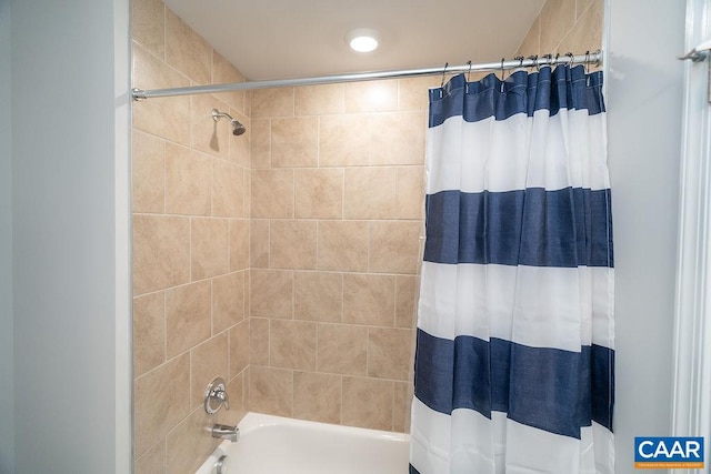 bathroom featuring shower / tub combo with curtain