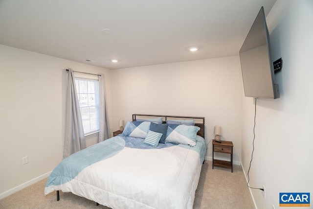 bedroom featuring light colored carpet