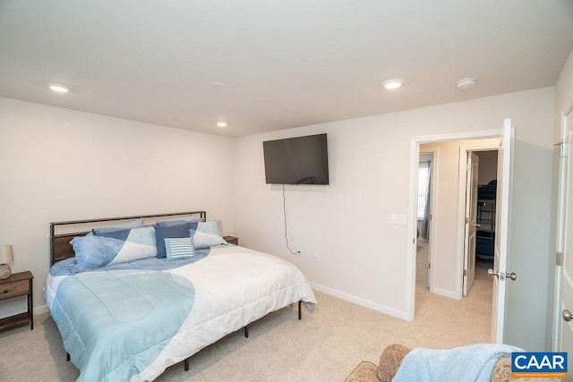 bedroom featuring light carpet