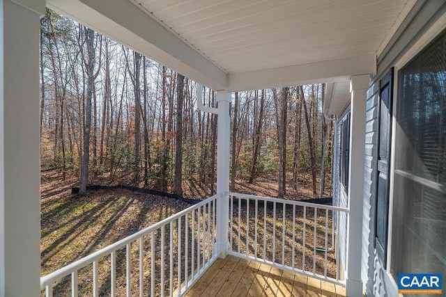 wooden terrace with a porch