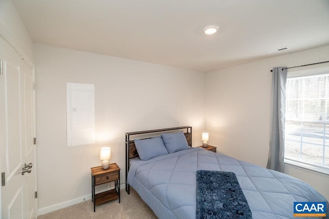 bedroom featuring light carpet